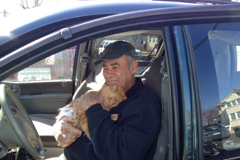 Willie Ortiz feeds stray cats in Connecticut